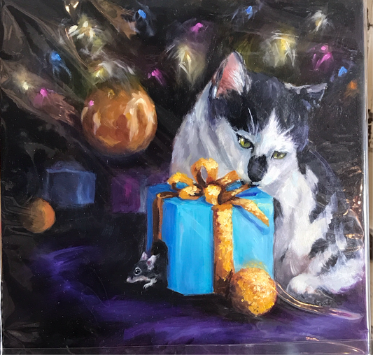 Cat biting a Christmas present.  Why do cats bit and the lick - explore artwork and animal behavior
