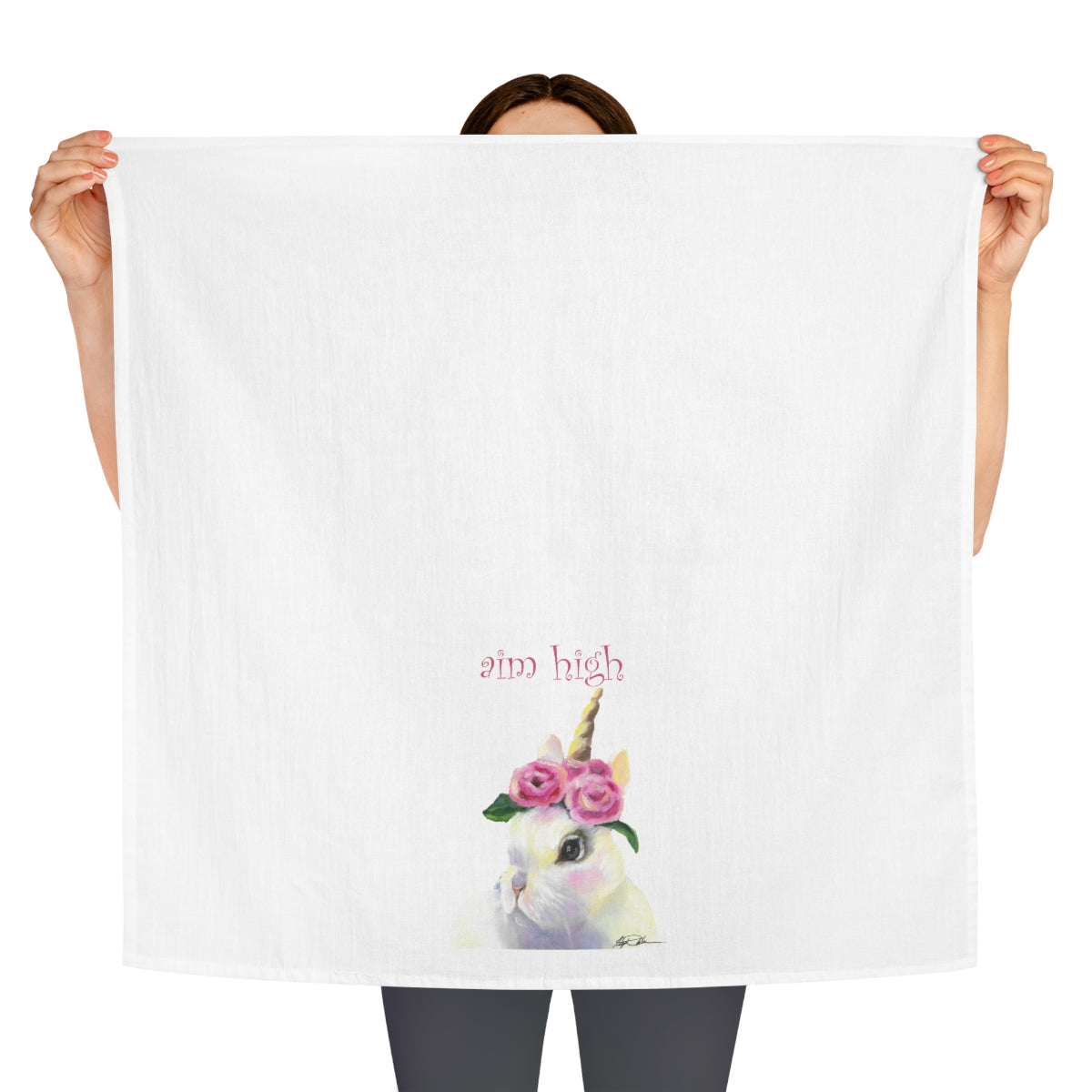 person holding the bunny tea towel