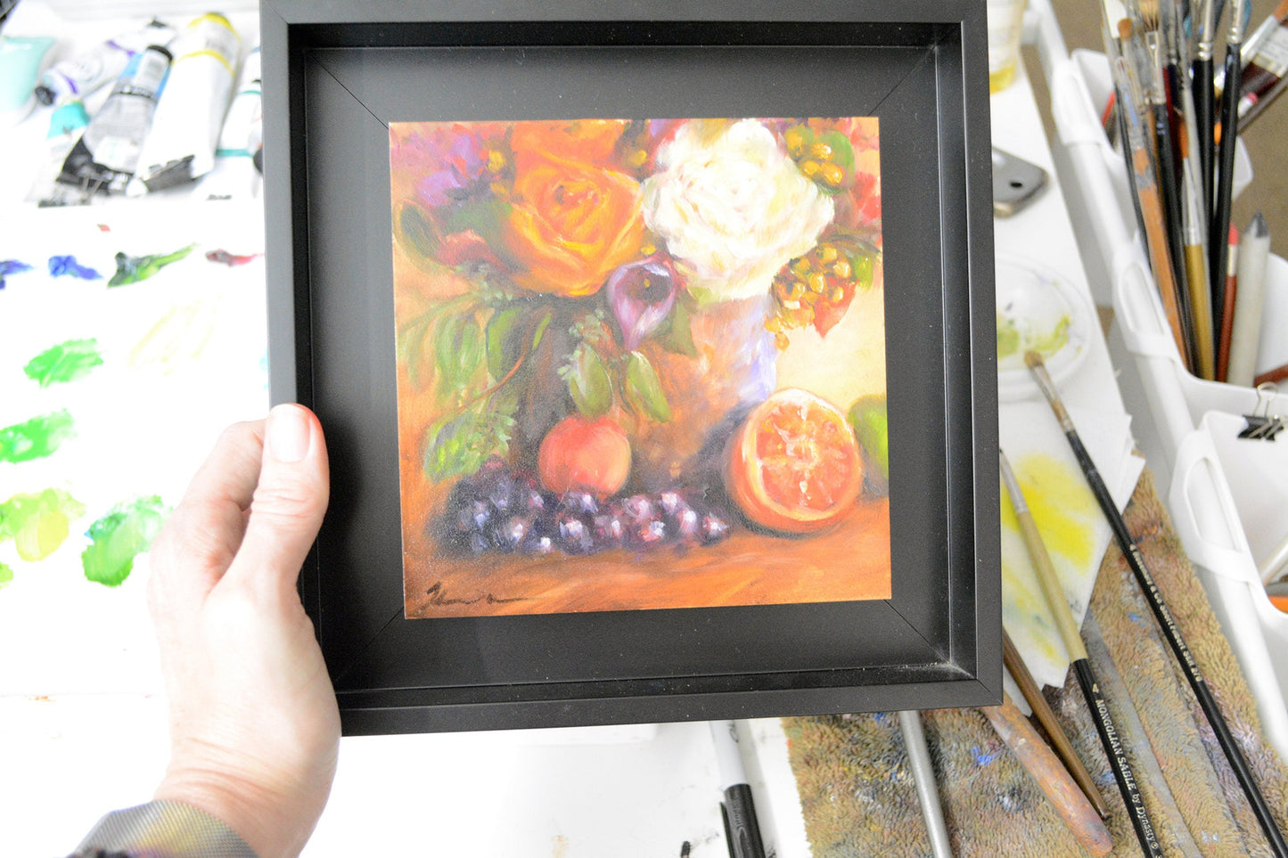 vibrant oil painting of a copper pot with flowers and grapes